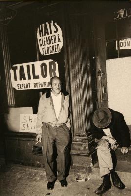 Untitled (men in front of tailor shop)