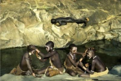 Surma Girls Painting by the Riverbank, Ethiopia